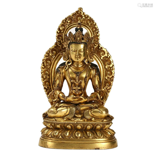 A GILT-BRONZE FIGURE OF SEATED AMITAYUS