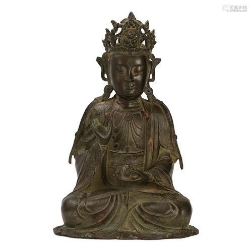 A BRONZE SEATED GUANYIN