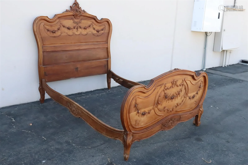 A French antique walnut carved bed