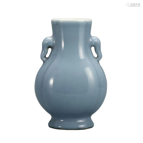 A SKY BLUE-GLAZED VASE WITH HANDLES