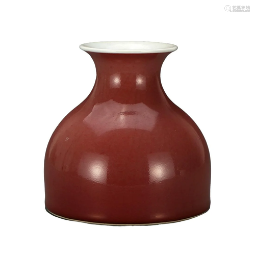 A RED-GLAZED BOTTLE VASE