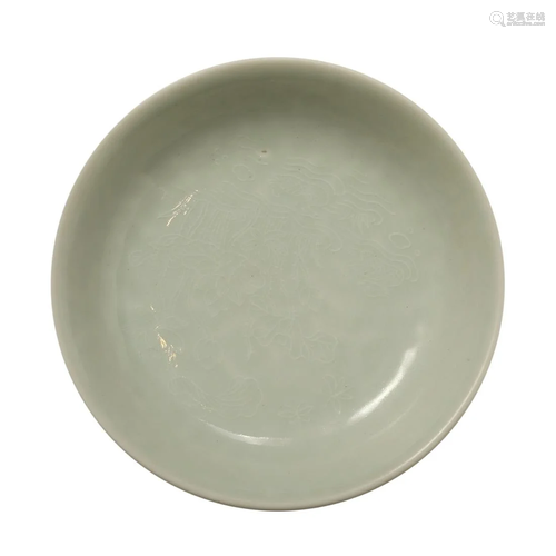 A CARVED WHITE-GLAZED FLORAL DISH