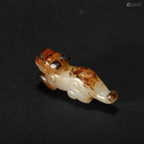 A WHITE AND RUSSET JADE PENDANT