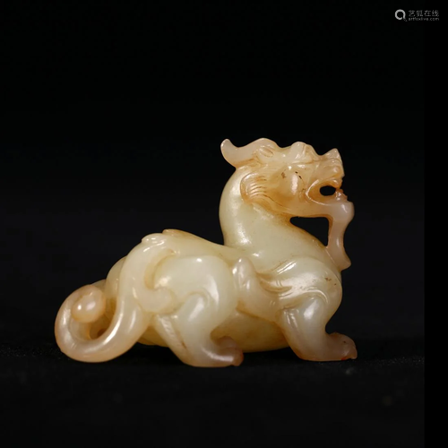 A WHITE AND RUSSET JADE MYTHICAL BEAST, CHINA