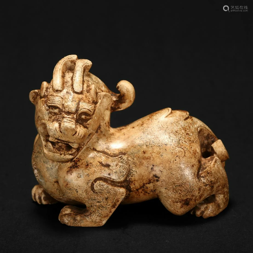 A MOTTLED YELLOW JADE 'BEAST' CARVING