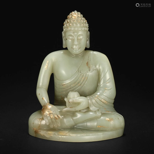 A WHITE JADE FIGURE OF SHAKYAMUNI