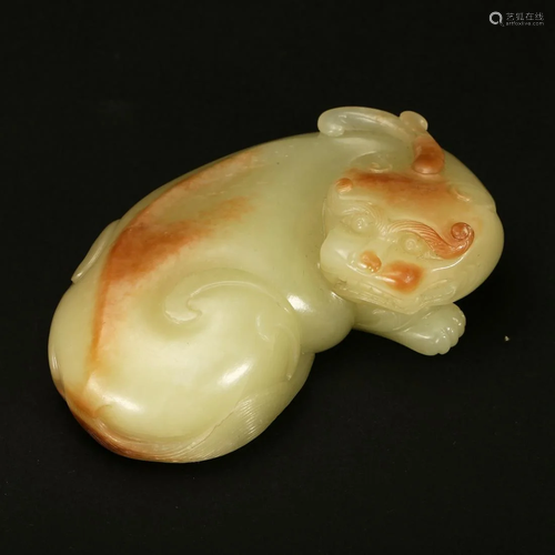 A WHITE AND RUSSET JADE 'BEAST' CARVING