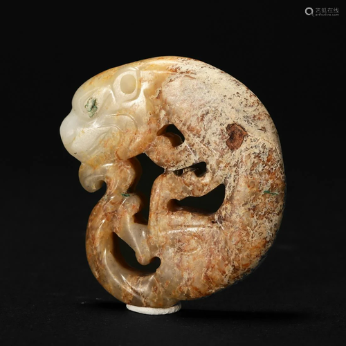 A MOTTLED YELLOW JADE 'TIGER' CARVING