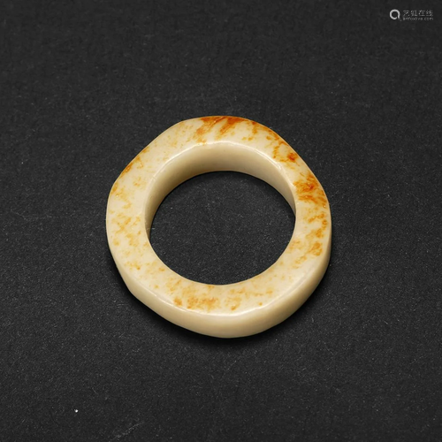 A WHITE JADE THUMB RING