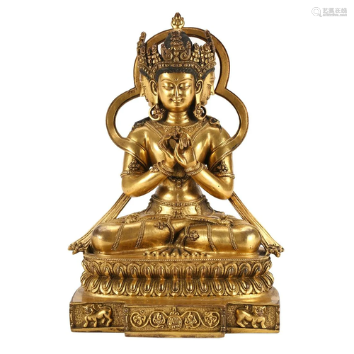 A GILT-BRONZE FIGURE OF SEATED BUDDHA