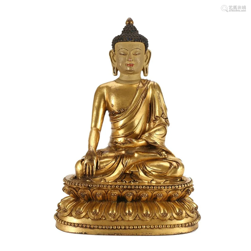 A GILT-BRONZE FIGURE OF SEATED SHAKYAMUNI