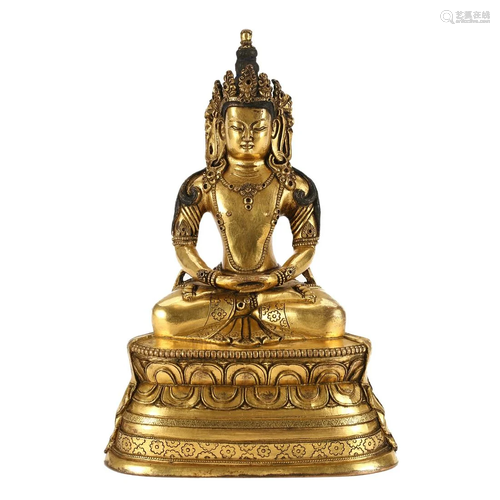 A BILT-BRONZE FIGURE OF SEATED BODHISATTVA