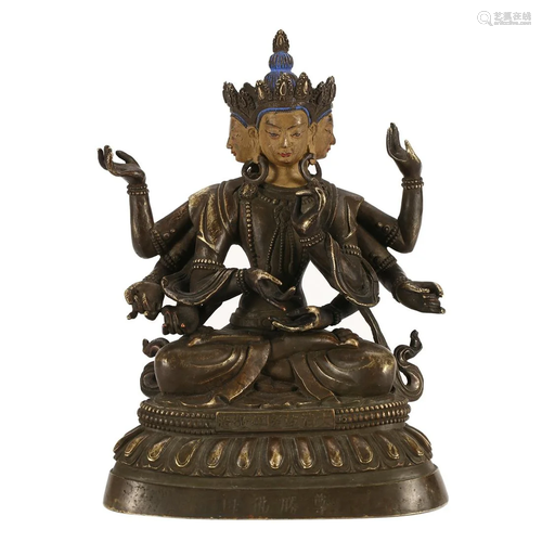 A BRONZE FIGURE OF A SIX-ARMED BUDDHA