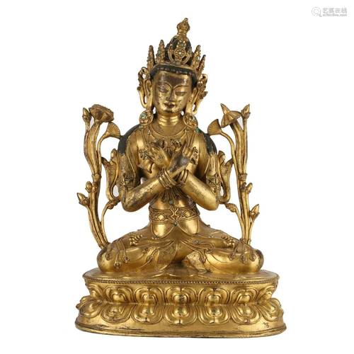 A GILT-BRONZE FIGURE OF SEATED TARA