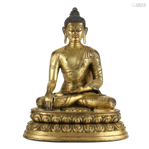 A GILT-BRONZE FIGURE OF SEATED SHAKYAMUNI