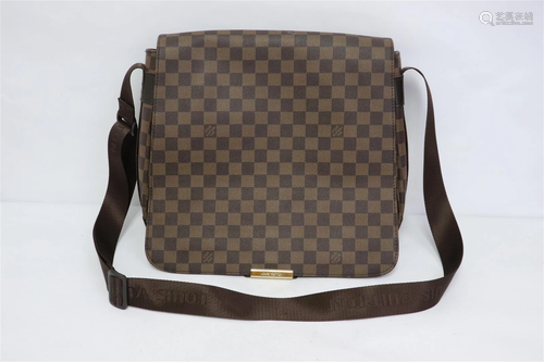 A marked Louis Vuitton bag with shoulder strip