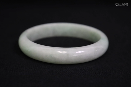 A natural color jadeite bangle bracelet