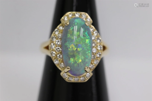 An 18K Y/G opal ring with diamonds