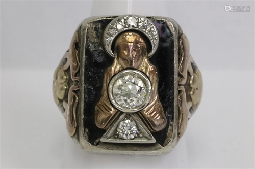 A silver and gold ring w/ diamond