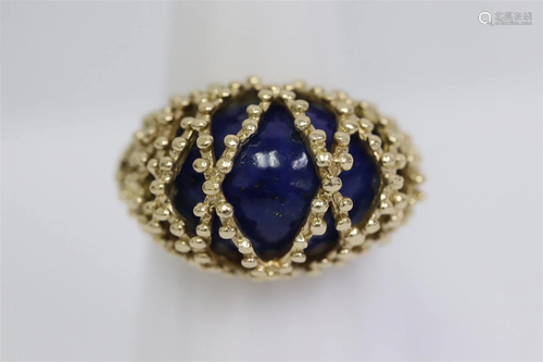 14K Y/G ring, top caged a fine blue stone