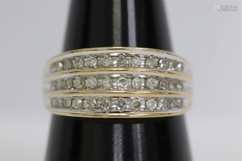 A 10K Y/G ring, channel set with small diamonds