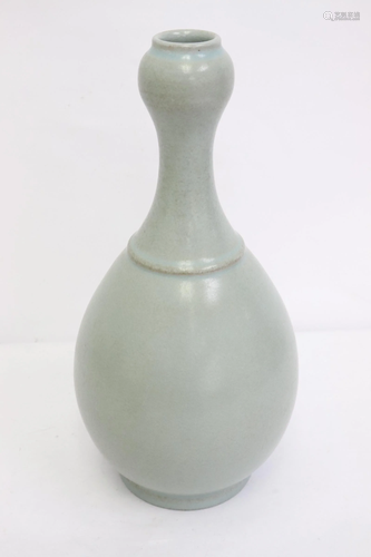 A light celadon porcelain garlic top vase