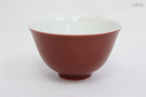 A small purple glazed tea bowl