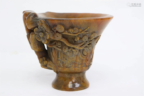 A simulated horn libation cup