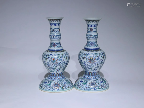 TWO CHINESE DOUCAI CANDLE HOLDERS DEPICTING ' LOTUS SCR...