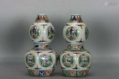 TWO CHINESE FAMILLE-VERTE DOUBLE-GOURD VASES DEPICTING '...