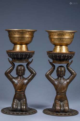 A pair of gilt bronze lamps of ancient Chinese nobles