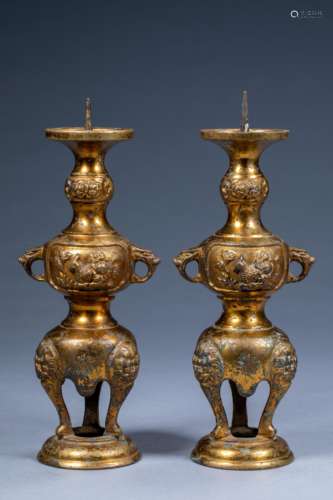 A pair of gilt imperial candlesticks in the Manchu Palace