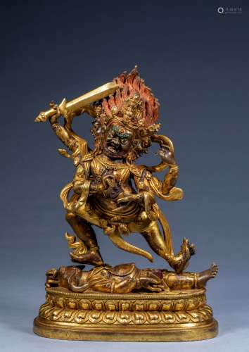 Chinese Qing Dynasty official gilt statue with four arms and...