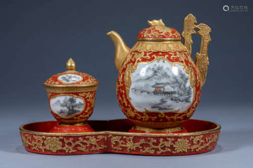 A set of tea set with sand red lacquer and gold mountain wat...