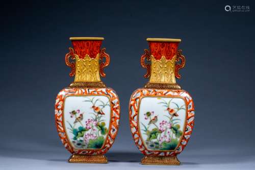 A pair of golden flower and bird appreciation vases in the Q...