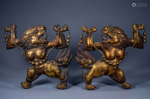 A pair of ancient Chinese Buddhist gods and beasts