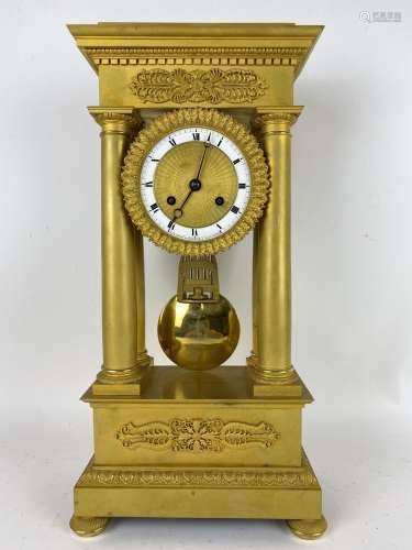 A 19th century French Empire style gilt metal portico clock,...