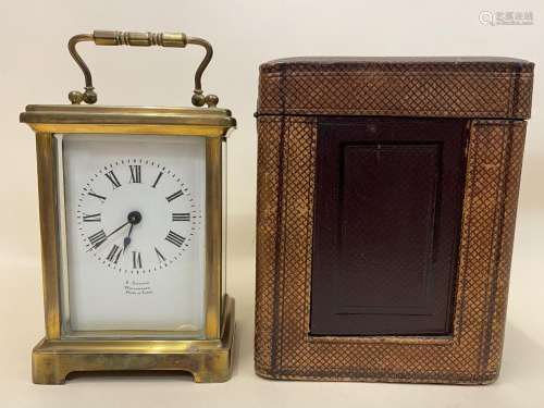 An early 20th century brass cased carriage clock, the white ...