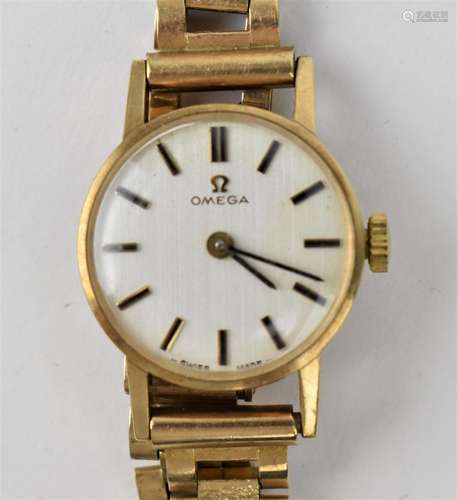 An Omega ladies 9ct gold manual wind wristwatch having a sil...