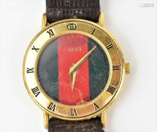 A Gucci quartz, ladies gold plated wristwatch having a two t...