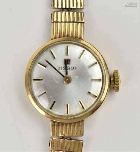 A Tissot manual wind, ladies 9ct gold having a silvered dial...