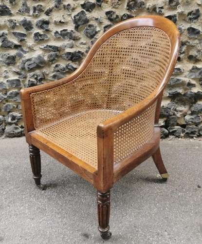 A Regency mahogany bergere chair, in the manner of Gillows, ...