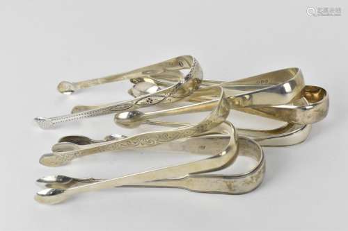 A collection of George III period English silver sugar tongs...