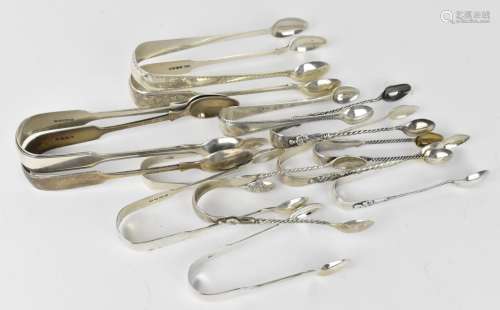 A collection of Victorian silver sugar tongs, some with brig...