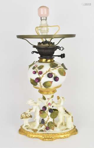A late Victorian Moore Bros porcelain converted oil lamp, th...