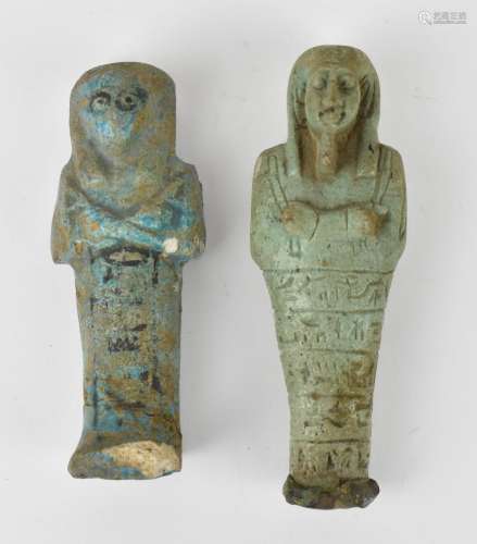 Two Egyptian funerary ushabti figures, both in blue/green gl...