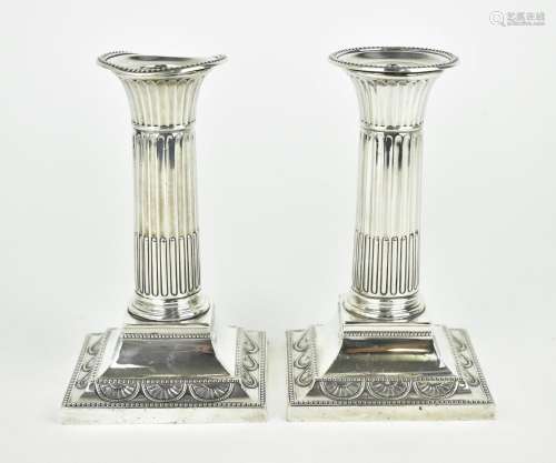 A pair of late Victorian silver dwarf candlesticks by Willia...