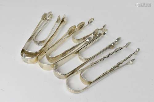 A collection of mixed silver sugar tongs, to include Georgia...