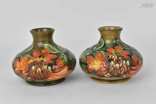 A pair of Moorcroft pottery vases designed by Philip Gibson,...