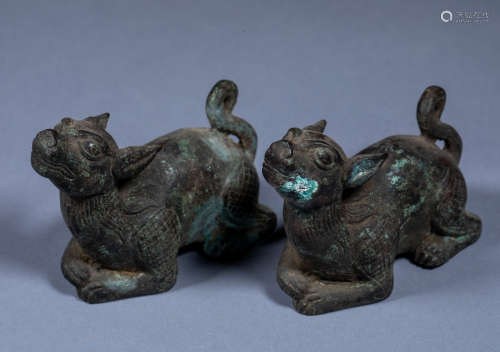 A pair of ancient Chinese bronze auspicious animals